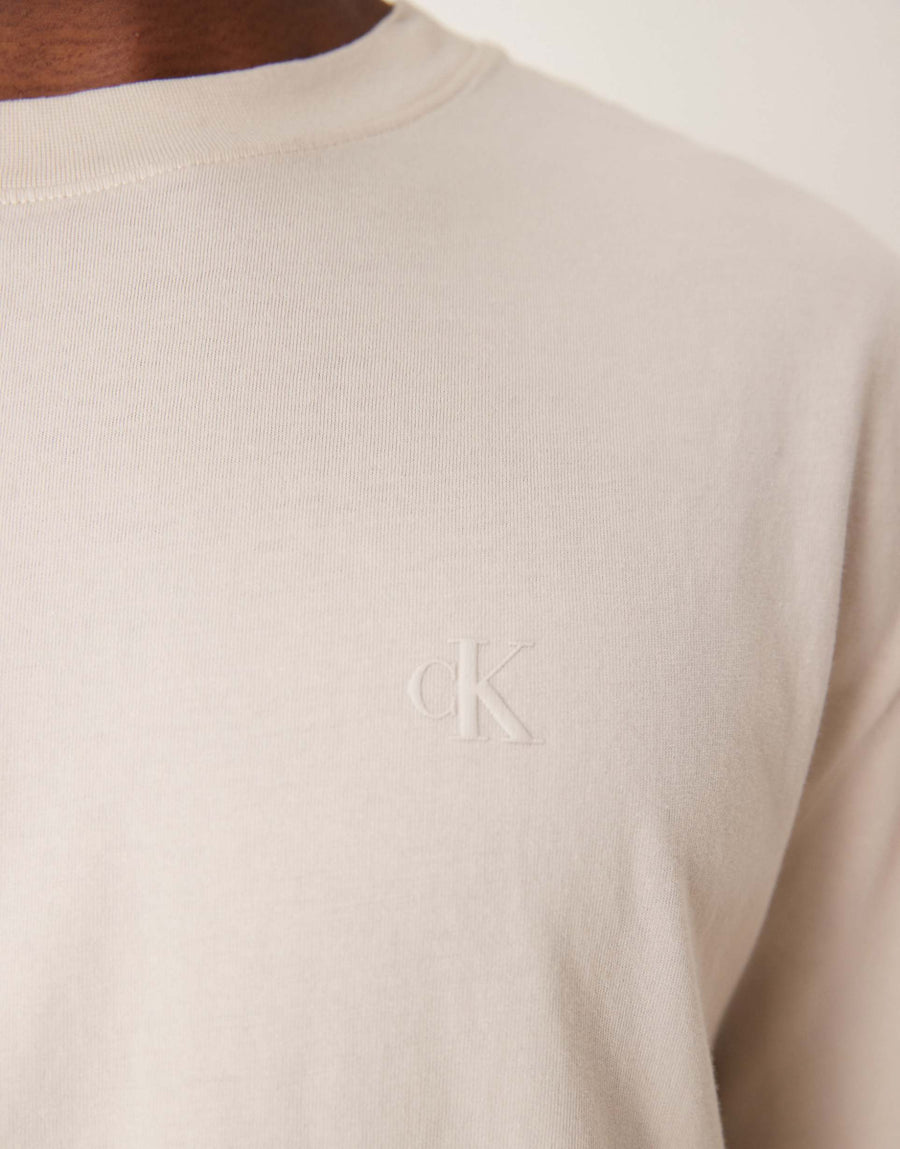 Calvin Klein Jeans logo back print t-shirt in washed oatmeal.